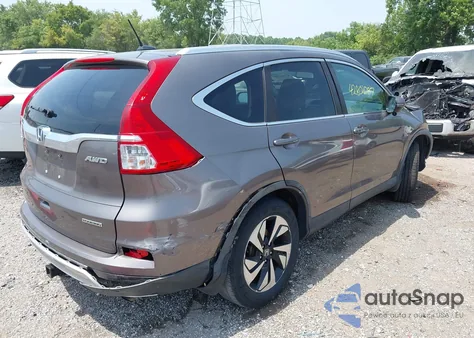 2015 Honda Cr-V Touring z USA, uszkodzony, nr VIN 5J6RM4H98FL126114